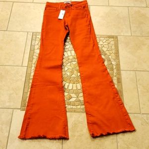 Orange stretchy size 25 flared jeans